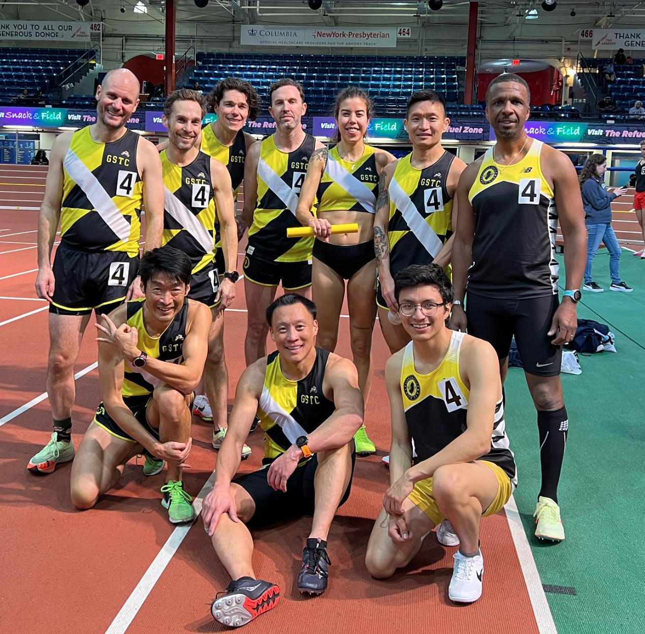 Garden State Track Club runners racing in branded apparel
